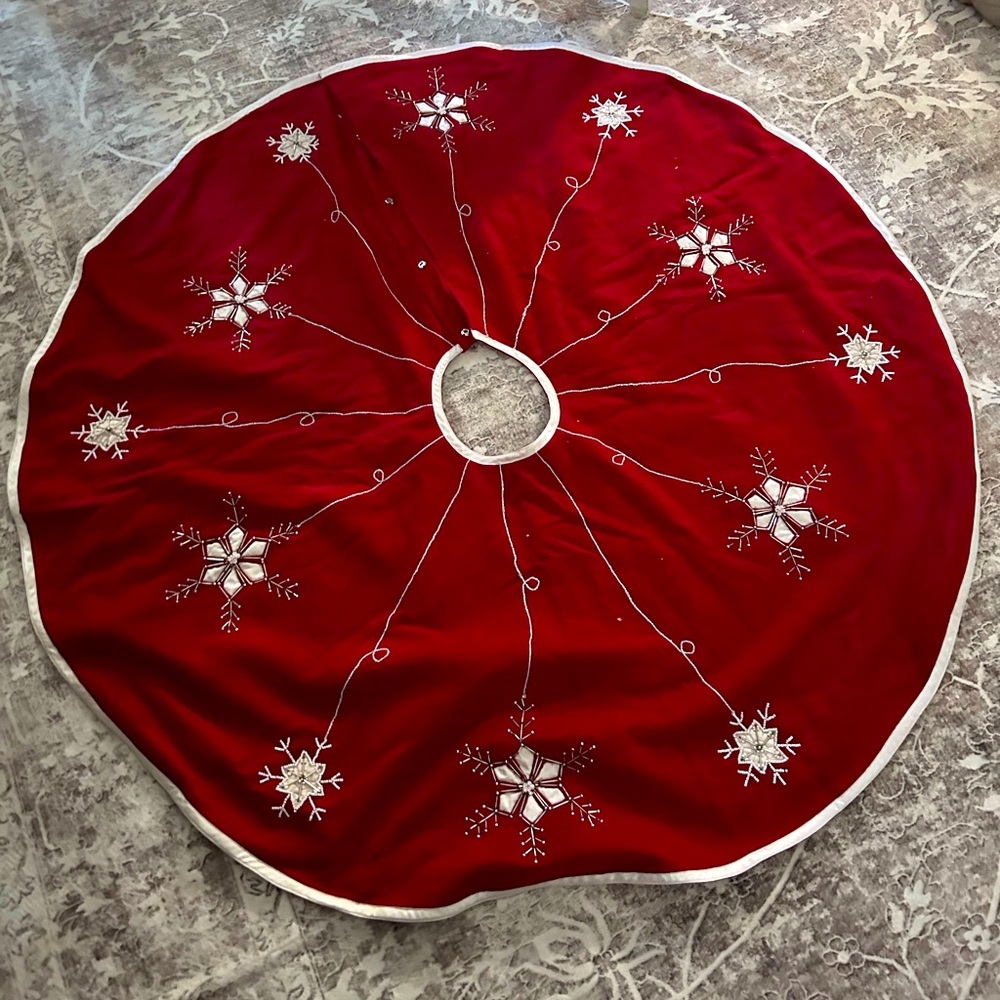 Crate and Barrel 54” Red with Snowflake Christmas tree skirt.